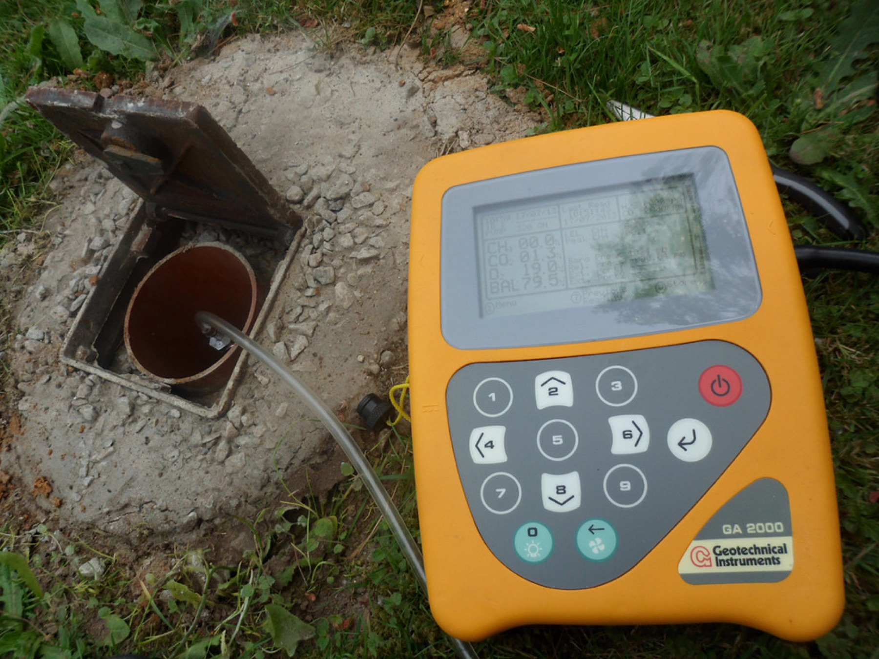 A ground-gas analyser connected to a borehole head.